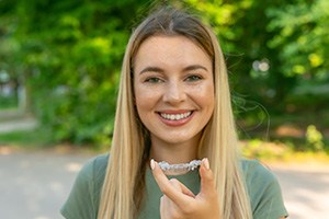 a patient holding their clear aligner