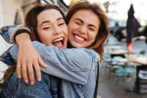 Smiling South Portland patient with new dental implant crown