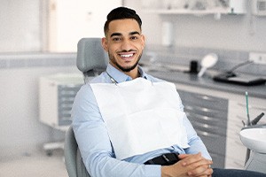 Smiling patient sitting in treatment chair
