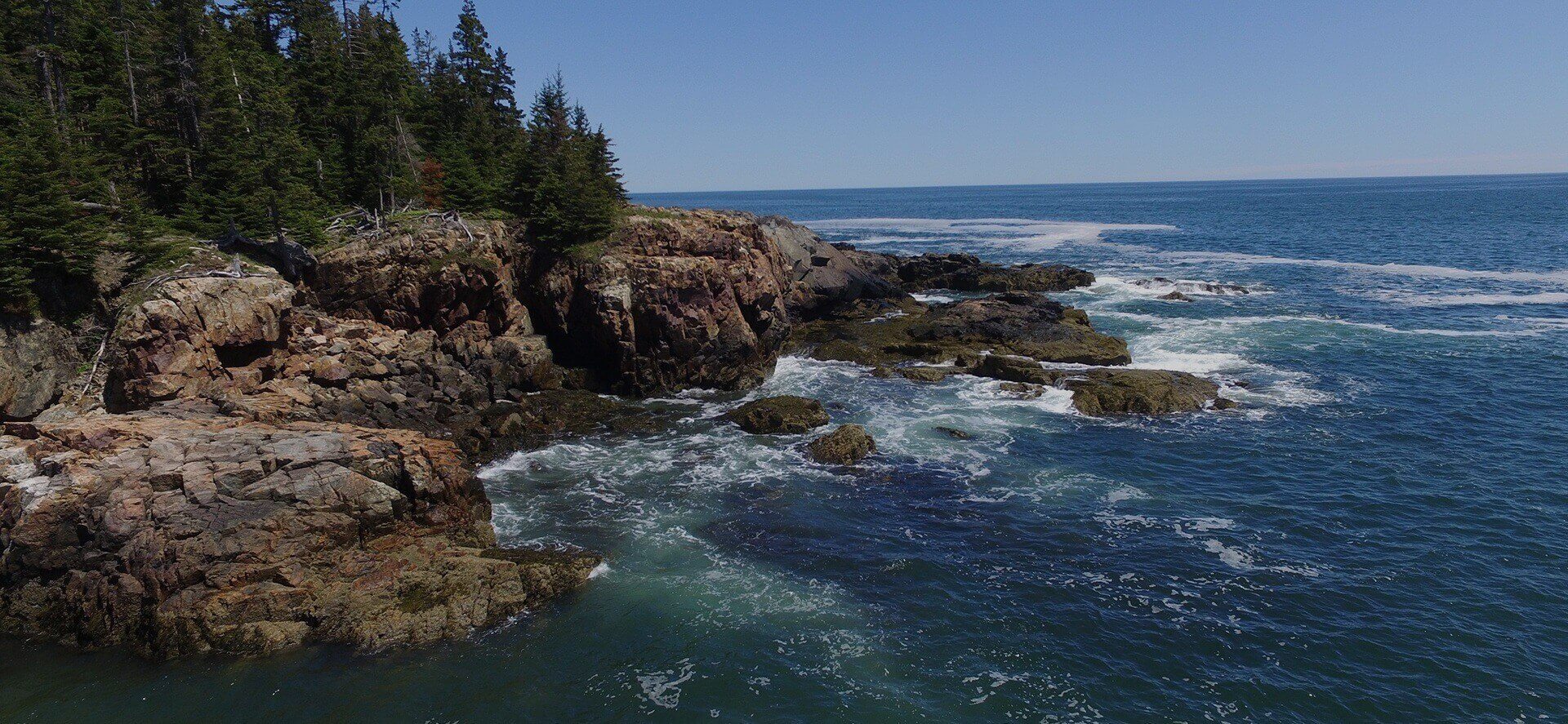 Waves crashing near a cliff