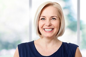 Woman with dentures in South Portland smiling