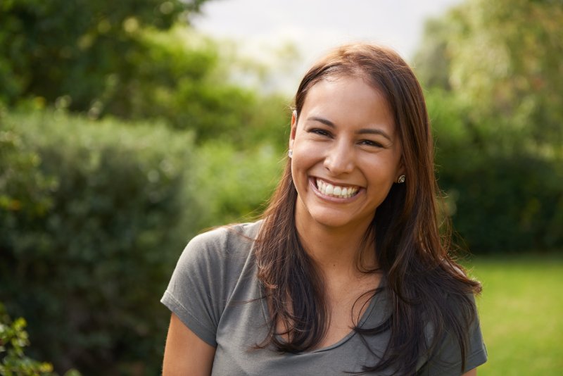 woman with dental implants smiling in South Portland