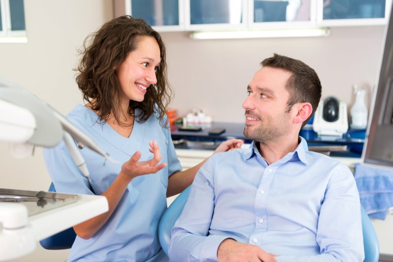 Patient talking to their dentist